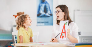 Image of a Speech Pathologist working with a child.