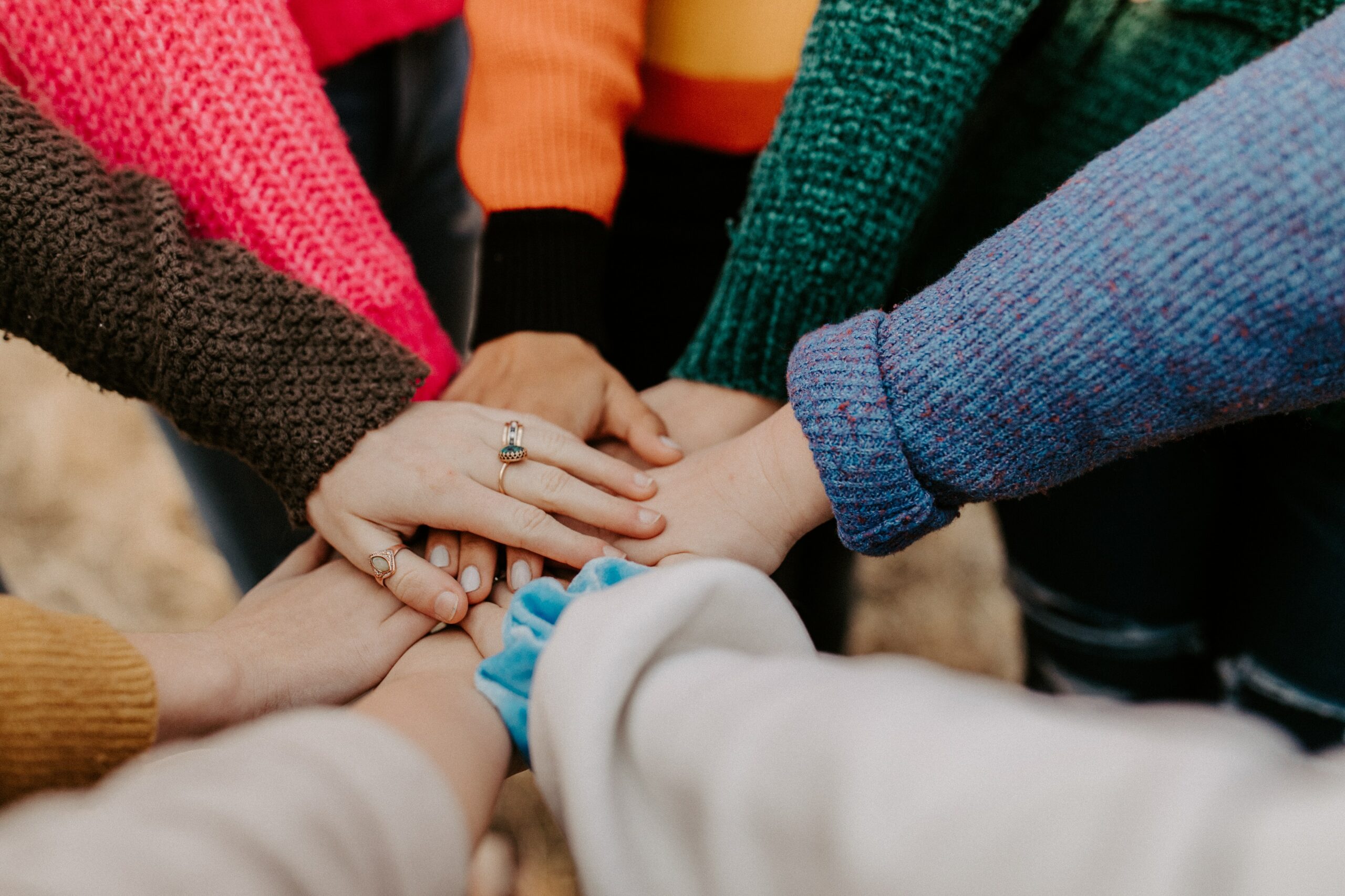 Group putting their hands in the middle