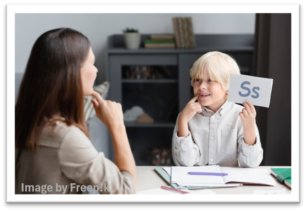 Speech therapist working with a child on a correct pronunciation using a prop with a letter 'Ss' picture.