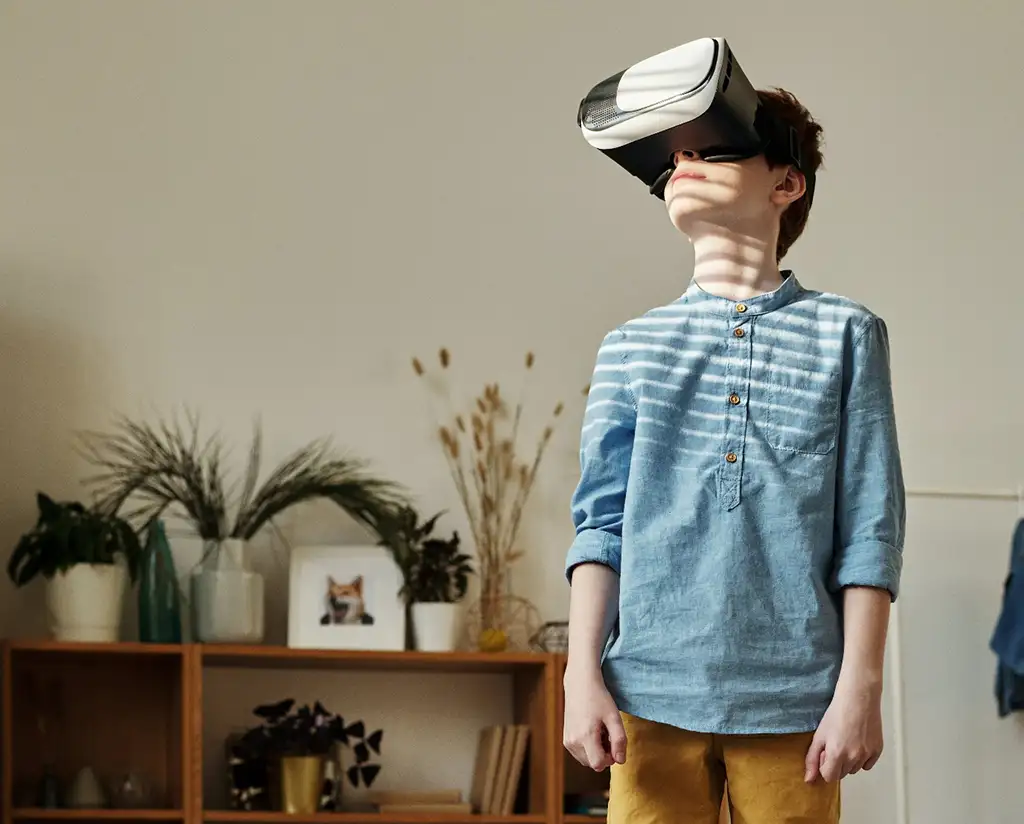 Photo of a young boy wearing a VR headset.