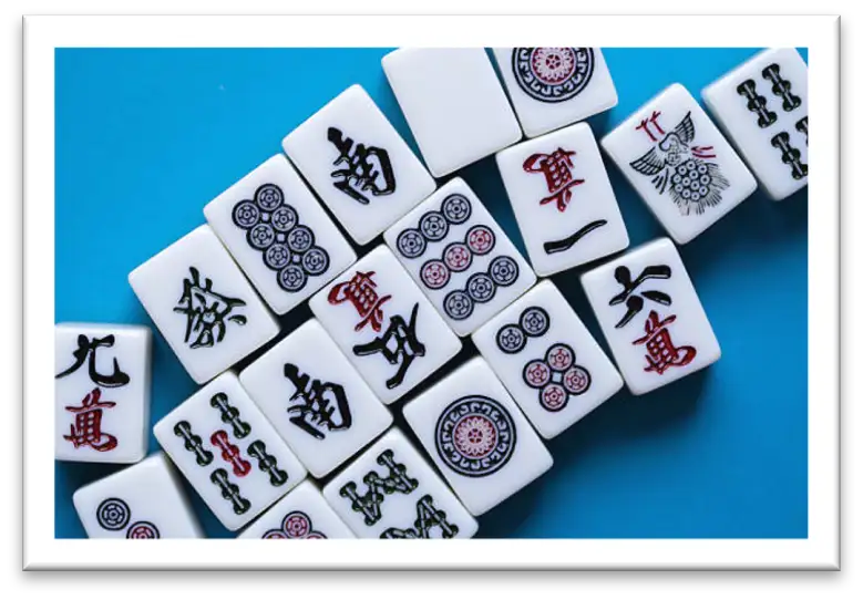 Mahjong tiles laid out on a blue background