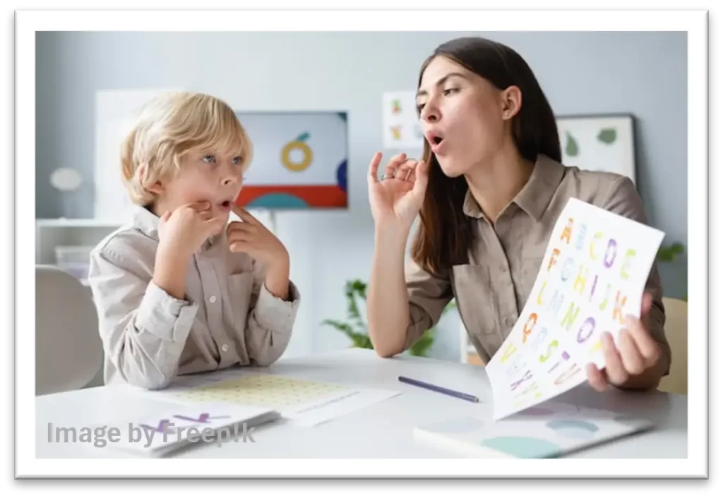 Speech therapist working with a child on how to pronounce an "O" sound.